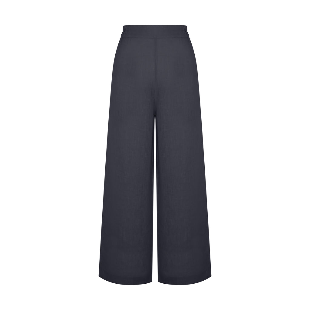 Vista frontal da Calça Yas Preta em linho puro, com modelagem ampla e caimento leve.