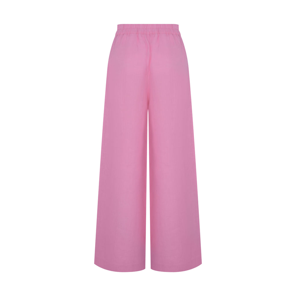 Vista traseira da Calça Yas Linho rosa com corte reto e caimento fluido, ideal para um visual leve e elegante.